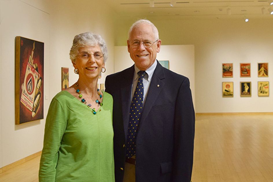 George Lilley stands with his wife, Mavis Grant, in the gallery at the Art Museum of WVU