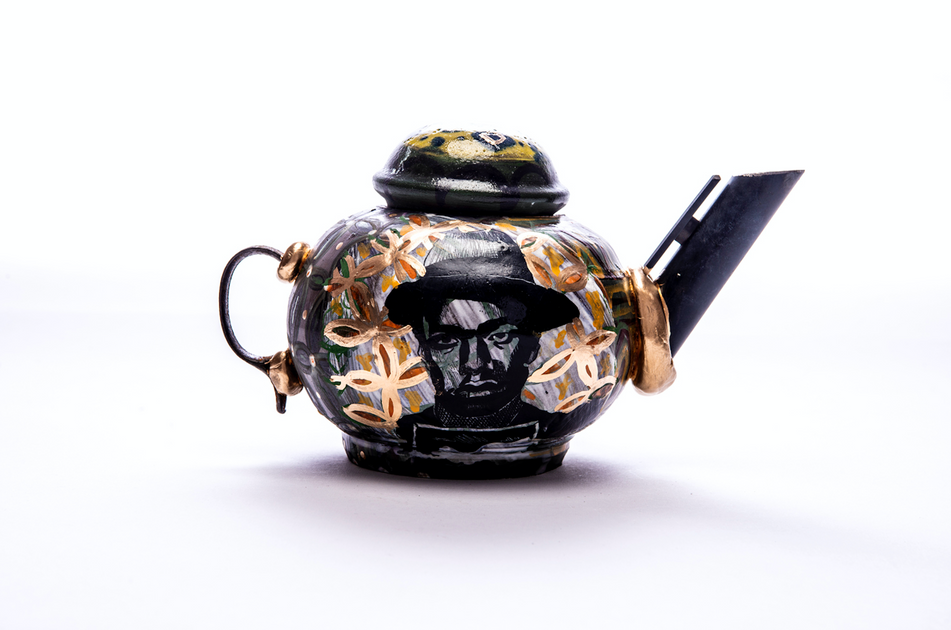 A ceramic teapot with gun parts by Philadelphia-based artist Roberto Lugo