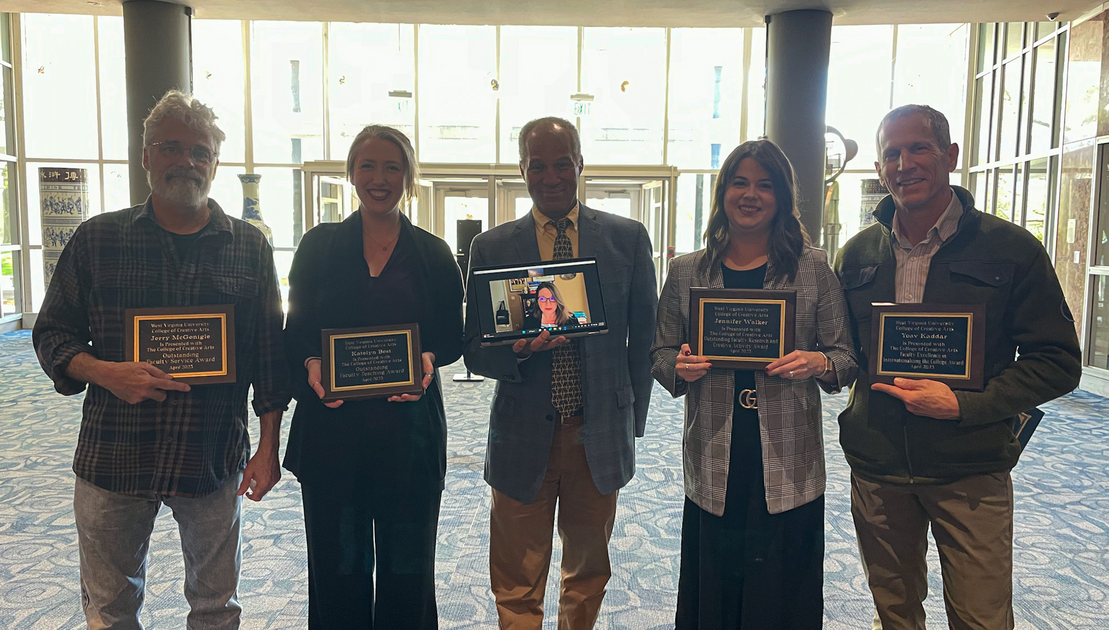 The faculty award winners stand with Dean Keith Jackson
