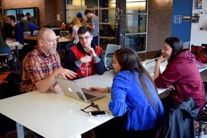 Moser works with students