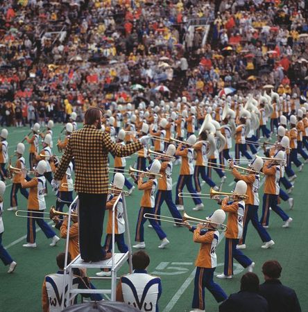 The WVU band performs at a football game